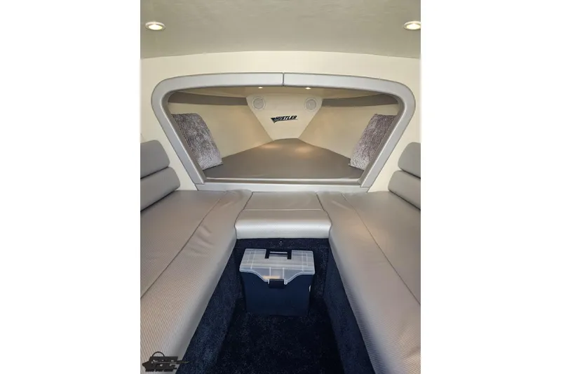 Slide: The Image of Interior of 2010 Hustler 266 Classic boat with seating and storage. - 68