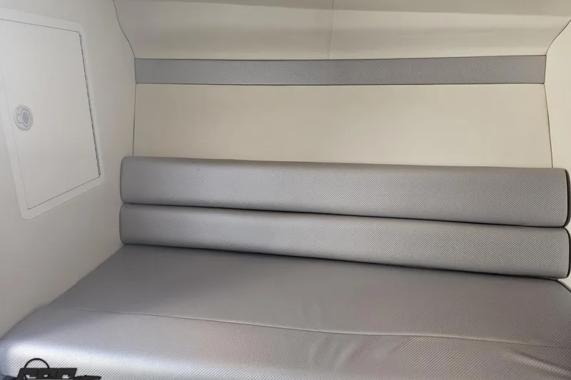 Slide: The Image of Interior cabin of 2010 Hustler 266 Classic boat with gray seating. - 73