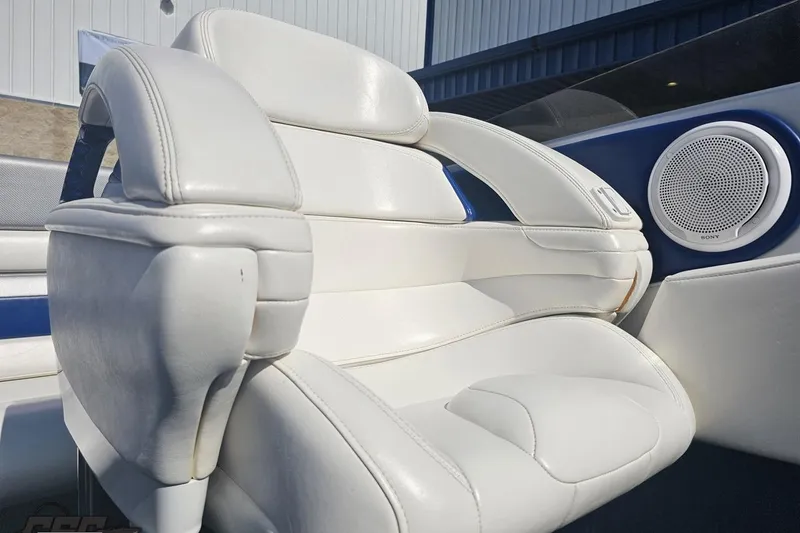 Slide: The Image of White leather seat in 2010 Hustler 266 Classic boat with speaker detail. - 79