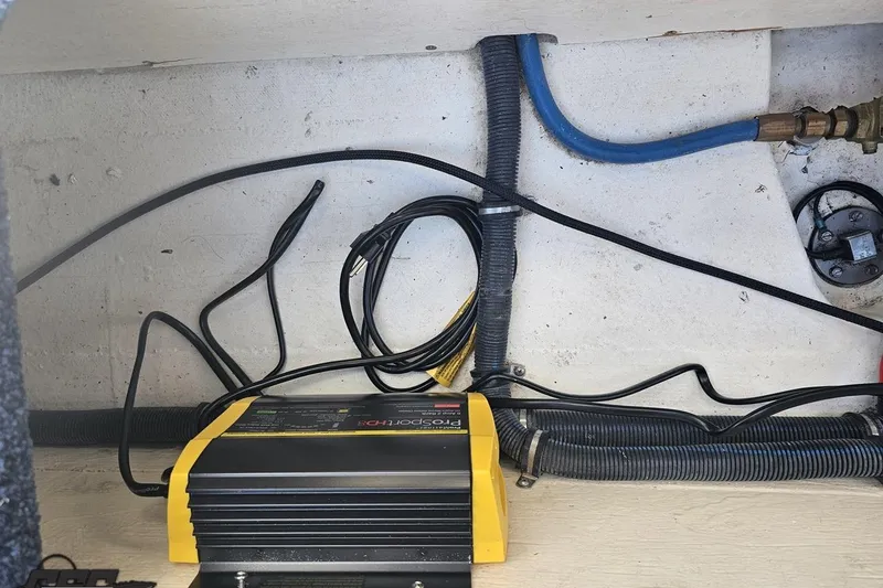 Slide: The Image of 2010 Hustler 266 Classic boat wiring and battery charger setup. - 83