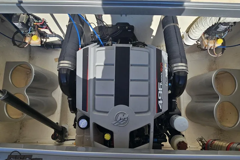 Slide: The Image of Engine compartment of a 2010 Hustler 266 Classic boat with 496 MAG HO engine. - 87
