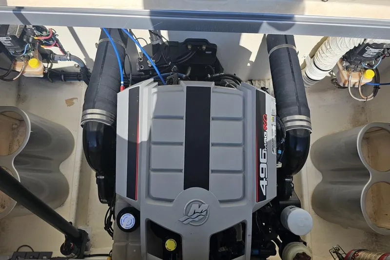 Slide: The Image of Engine compartment of a 2010 Hustler 266 Classic boat with 496 MAG HO engine. - 88
