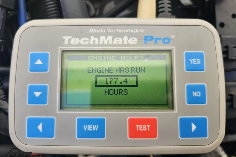 Slide: The Image of TechMate Pro displaying 177.4 engine hours for Hustler 266 Classic, 2010 model. - 91
