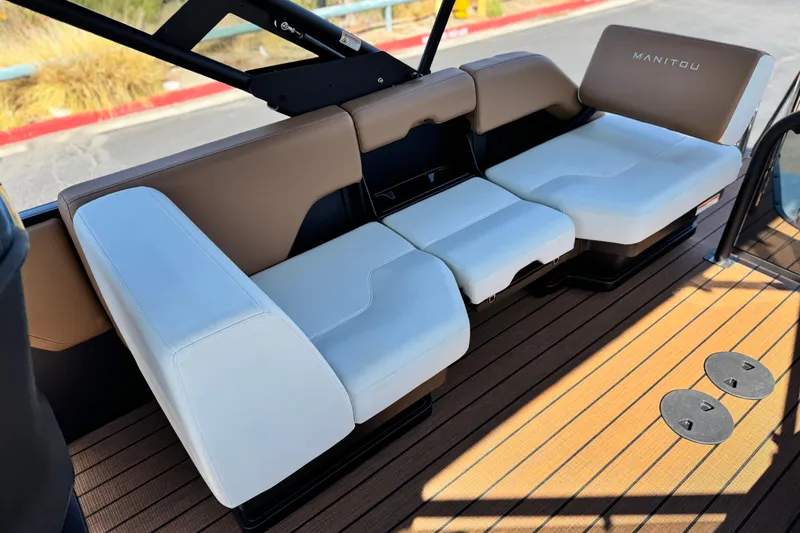 Slide: The Image of Luxurious seating on 2026 Manitou EXPLORE 22 boat with sleek design and comfortable cushions. - 14