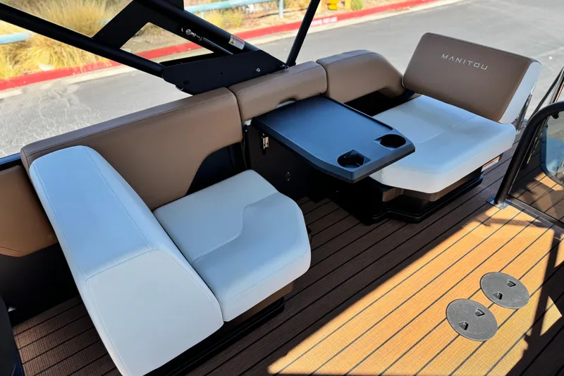 Slide: The Image of Interior of 2026 Manitou EXPLORE 22 boat with stylish seating and table. - 16
