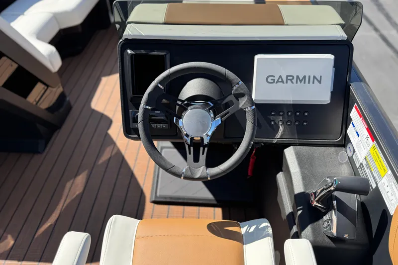 Slide: The Image of Steering console of 2026 Manitou EXPLORE 22 with Garmin navigation system. - 24