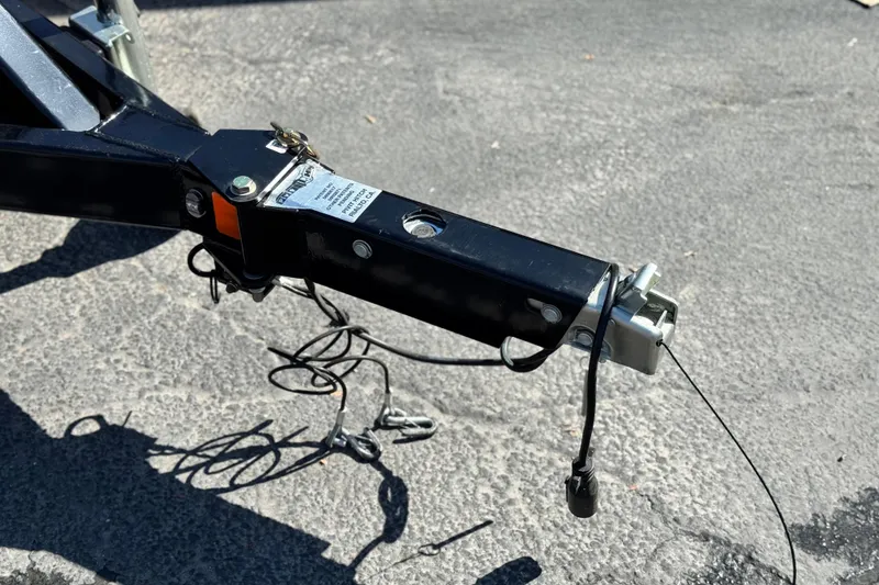 Slide: The Image of Trailer hitch of 2026 Manitou EXPLORE 22 on asphalt surface. - 26