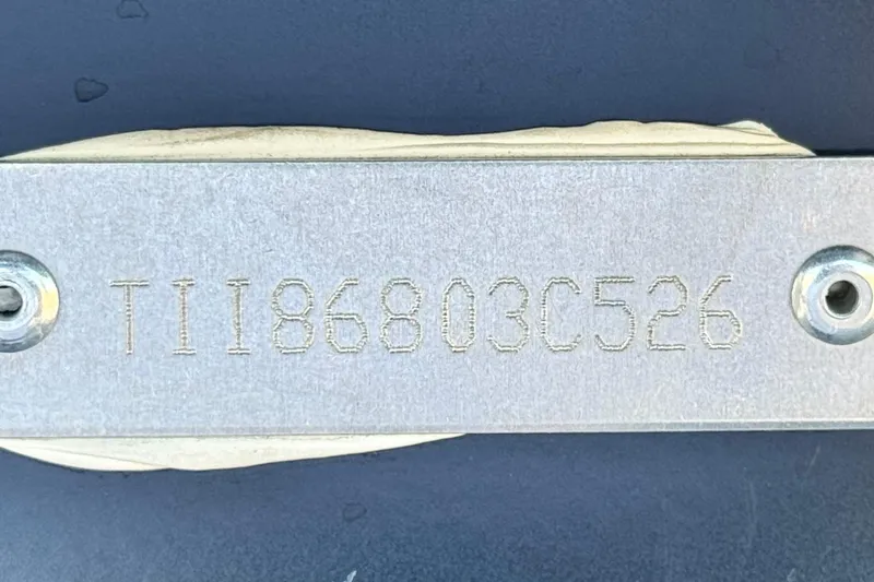 Slide: The Image of Metal plate with engraved serial number TII86803C526, Manitou EXPLORE 22, 2026 model. - 28