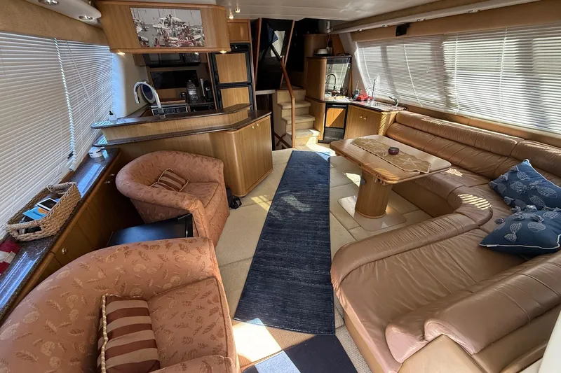 Slide: The Image of Luxurious interior of 2002 Bayliner 4788 Pilot House Motoryacht with plush seating and modern amenities. - 21