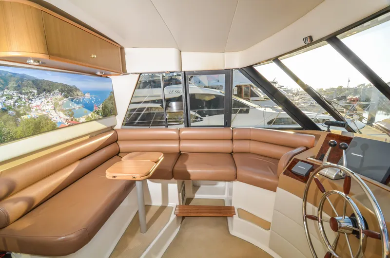 Slide: The Image of Interior of 2002 Bayliner 4788 Pilot House Motoryacht with leather seating and panoramic windows. - 37