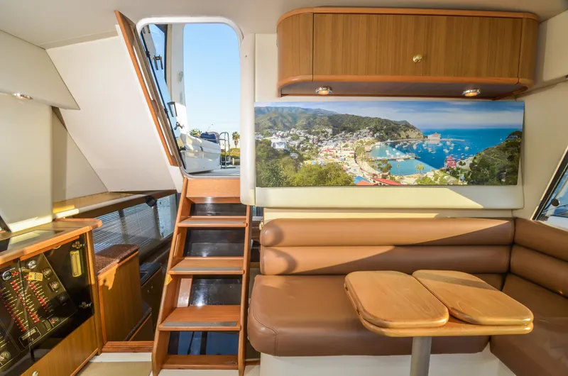 Slide: The Image of Interior of 2002 Bayliner 4788 Pilot House Motoryacht with seating and scenic artwork. - 38
