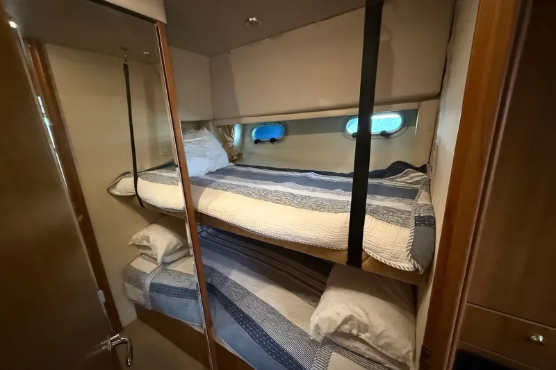 Slide: The Image of Bunk beds in 2002 Bayliner 4788 Pilot House Motoryacht cabin with nautical decor. - 48