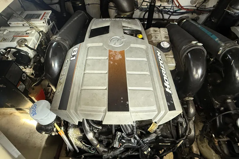 Slide: The Image of Engine compartment of a 2008 Sea Ray 350 Sundancer boat, featuring a Horizon 8.1 engine. - 12
