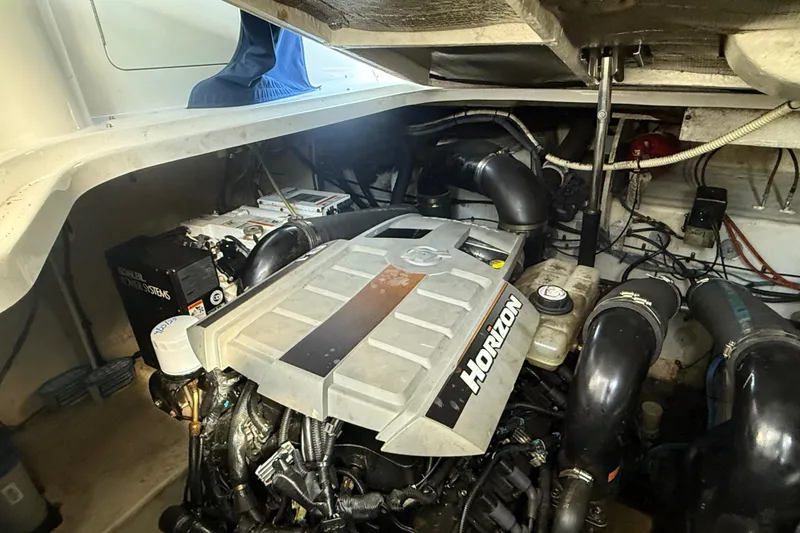 Slide: The Image of Engine compartment of a 2008 Sea Ray 350 Sundancer boat, featuring Horizon engine components. - 16