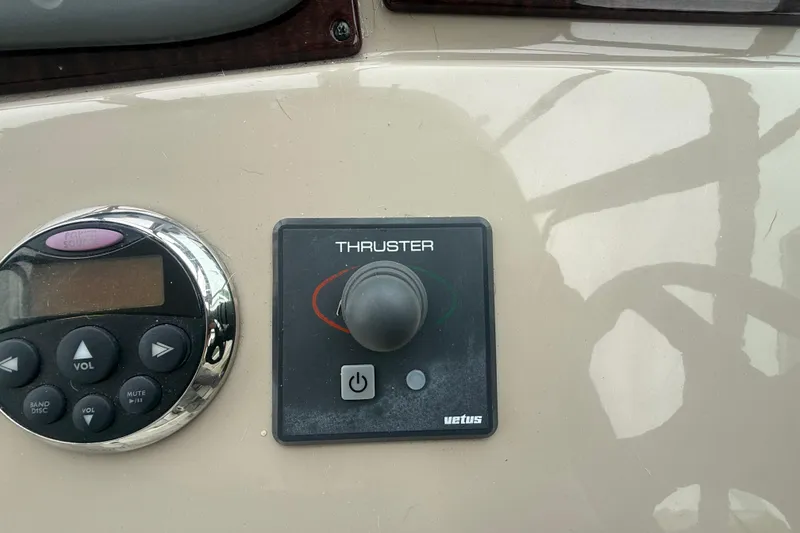 Slide: The Image of Control panel of a 2008 Sea Ray 350 Sundancer with thruster and audio controls. - 24