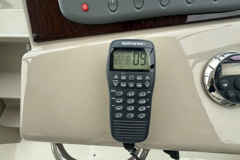 Slide: The Image of Control panel of a 2008 Sea Ray 350 Sundancer with Northstar marine radio. - 26