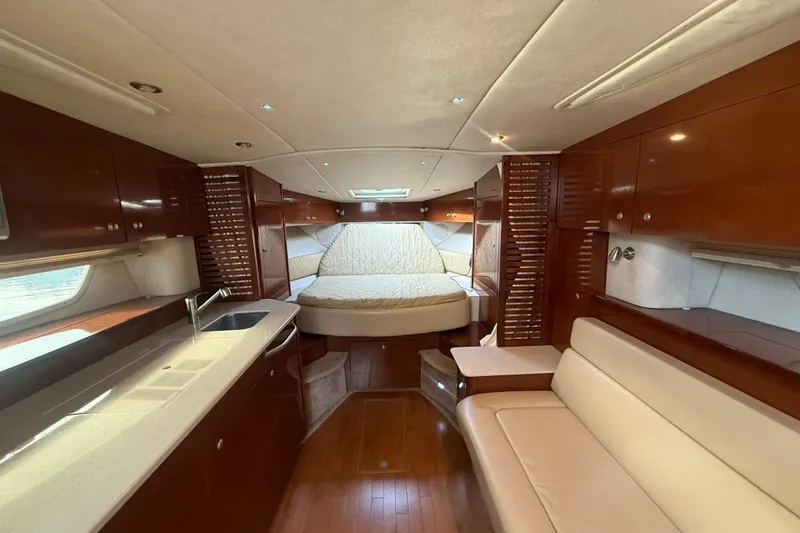 Slide: The Image of Luxurious interior of 2008 Sea Ray 350 Sundancer yacht with cozy bed and elegant wood finish. - 3
