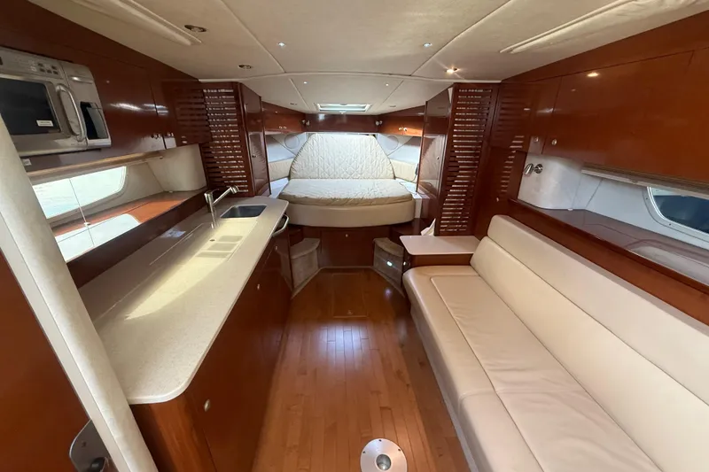 Slide: The Image of Luxurious interior of 2008 Sea Ray 350 Sundancer yacht with kitchen and seating area. - 5