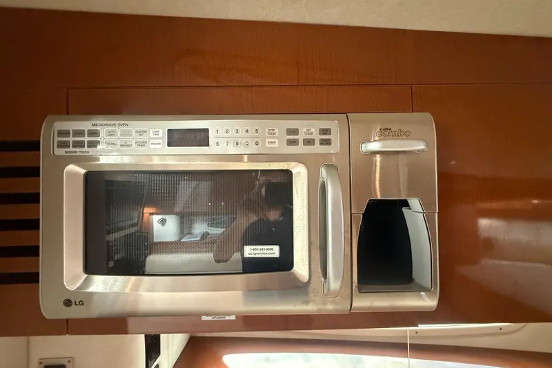 Slide: The Image of LG microwave and coffee maker in 2008 Sea Ray 350 Sundancer yacht kitchen. - 6