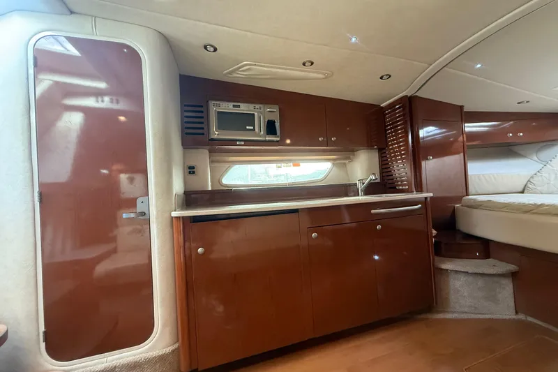 Slide: The Image of Interior of 2008 Sea Ray 350 Sundancer yacht with kitchenette and bed. - 8