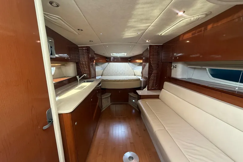 Slide: The Image of Luxurious interior of 2008 Sea Ray 350 Sundancer yacht with wood finishes and cozy seating. - 9