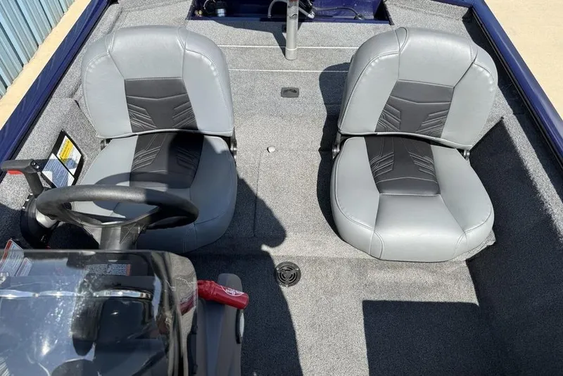 Slide: The Image of 2020 Tracker Pro 170 boat interior with two gray seats and steering wheel. - 14