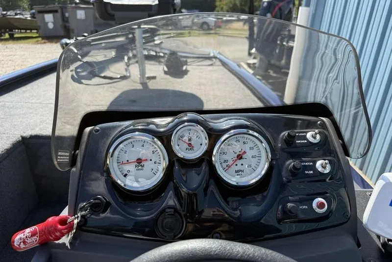 Slide: The Image of 2020 Tracker Pro 170 boat dashboard with gauges and controls. - 15