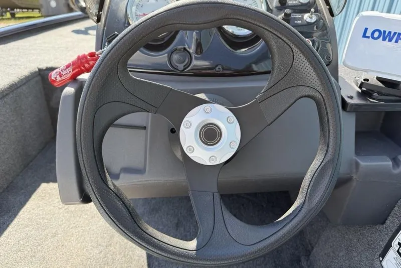 Slide: The Image of Steering wheel of 2020 Tracker Pro 170 boat with dashboard controls. - 16