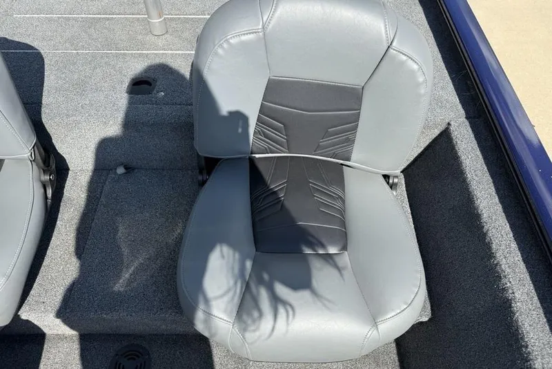 Slide: The Image of Gray seat on 2020 Tracker Pro 170 boat, with shadow and textured flooring. - 17