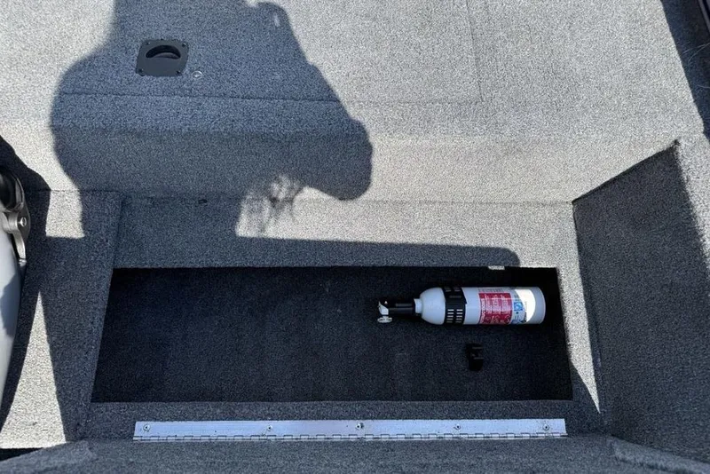 Slide: The Image of Storage compartment in 2020 Tracker Pro 170 boat with fire extinguisher. - 19
