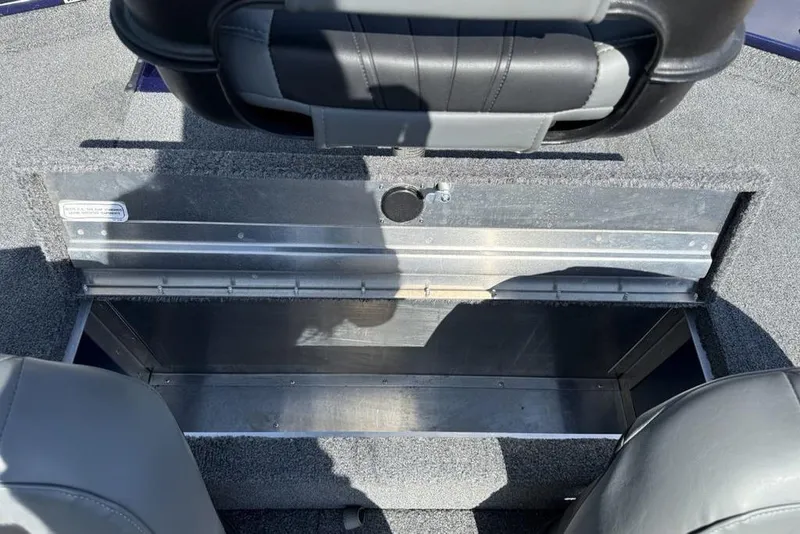 Slide: The Image of 2020 Tracker Pro 170 boat storage compartment with open lid and seating. - 23