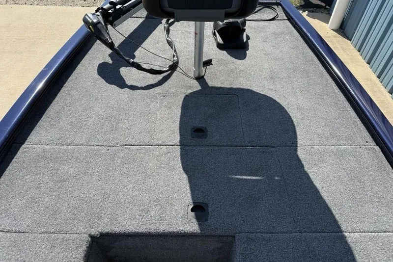 Slide: The Image of 2020 Tracker Pro 170 boat deck with carpeted surface and mounted equipment. - 6