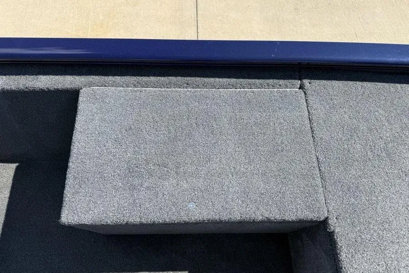 Slide: The Image of 2020 Tracker Pro 170 boat interior with gray carpeted seating area. - 8