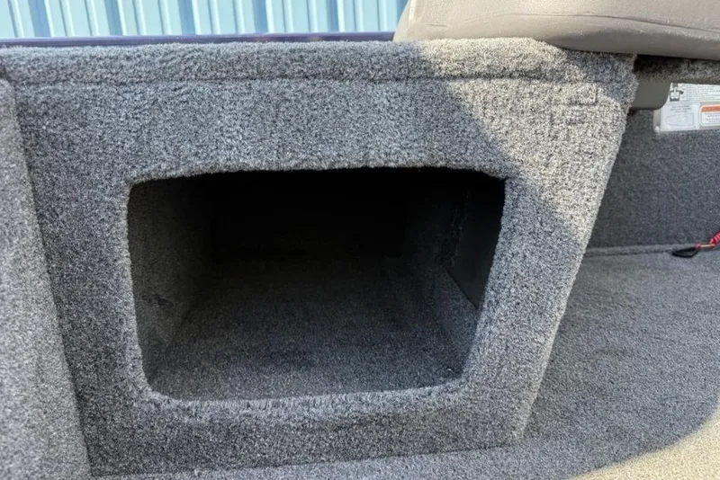 Slide: The Image of Carpeted storage compartment in a 2020 Tracker Pro 170 boat interior. - 9