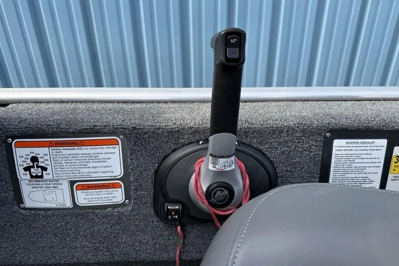 Slide: The Image of 2020 Tracker Bass Tracker Classic XL boat throttle and warning labels. - 14