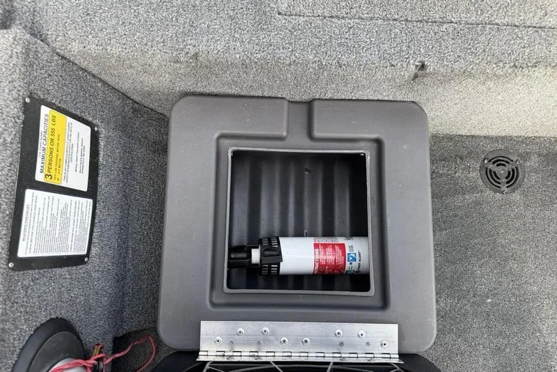 Slide: The Image of 2020 Tracker Bass Tracker Classic XL storage compartment with fire extinguisher. - 15