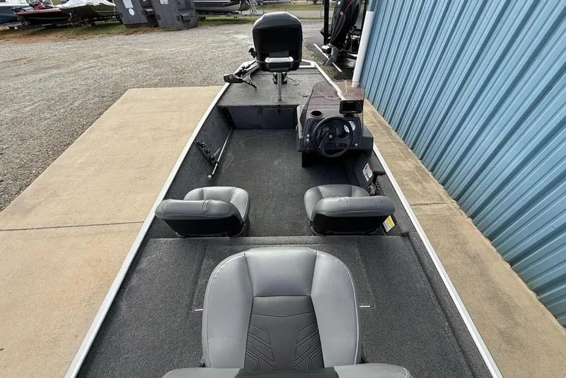 Slide: The Image of 2020 Tracker Bass Tracker Classic XL boat interior with seating and steering console. - 21