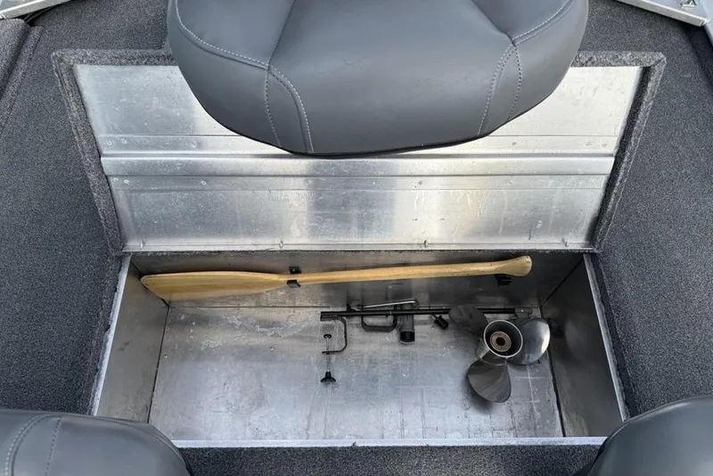 Slide: The Image of Storage compartment in a 2020 Tracker Bass Tracker Classic XL boat with paddle and propeller. - 23