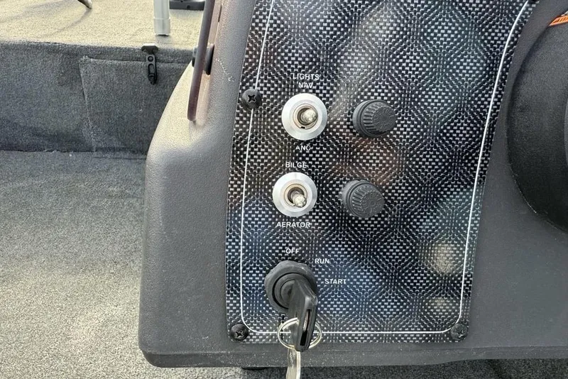 Slide: The Image of Control panel of 2020 Tracker Bass Tracker Classic XL boat with switches and key ignition. - 7
