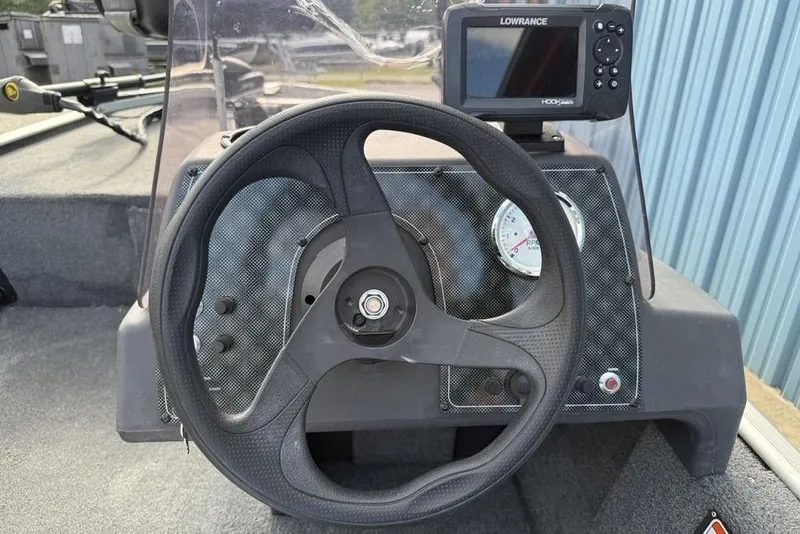 Slide: The Image of 2020 Tracker Bass Tracker Classic XL dashboard with steering wheel and Lowrance fishfinder. - 8