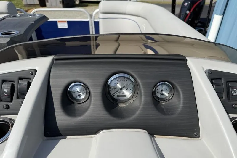 Slide: The Image of Dashboard of 2023 Bennington 22 boat with gauges and controls. - 14