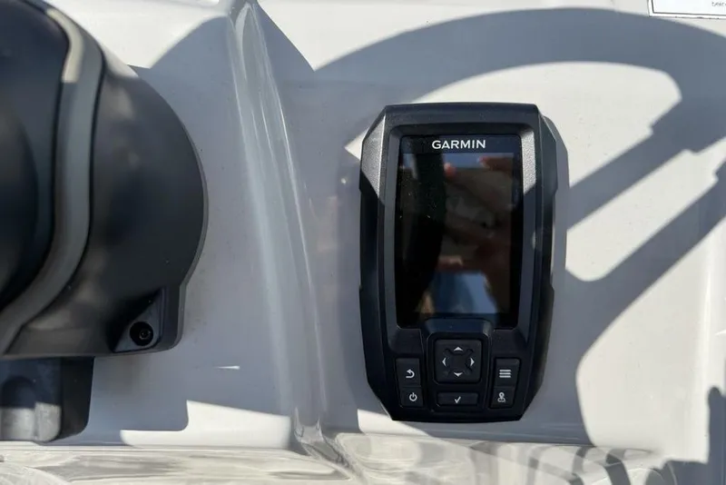 Slide: The Image of Garmin device on 2023 Bennington 22 boat dashboard, close-up view. - 17