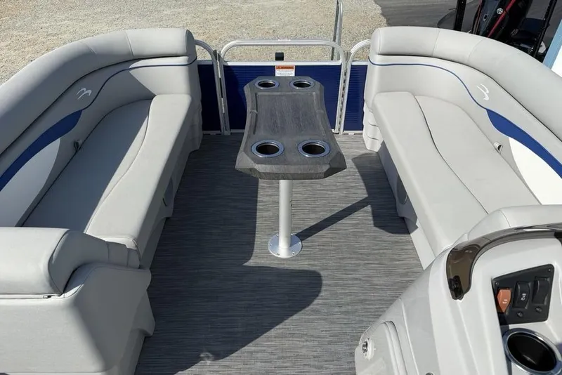 Slide: The Image of 2023 Bennington 22 boat interior with gray seating and central table. - 5