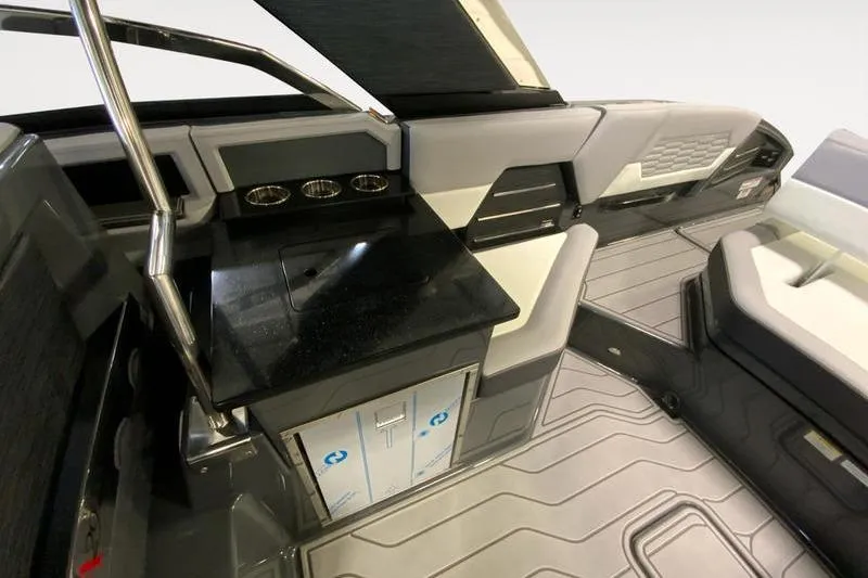 Slide: The Image of 2026 Cobalt A29 boat interior with sleek seating and modern design in a workshop setting. - 14