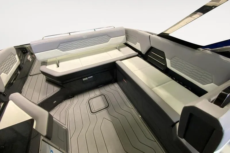 Slide: The Image of 2026 Cobalt A29 boat storage compartment with bag and informational label. - 18