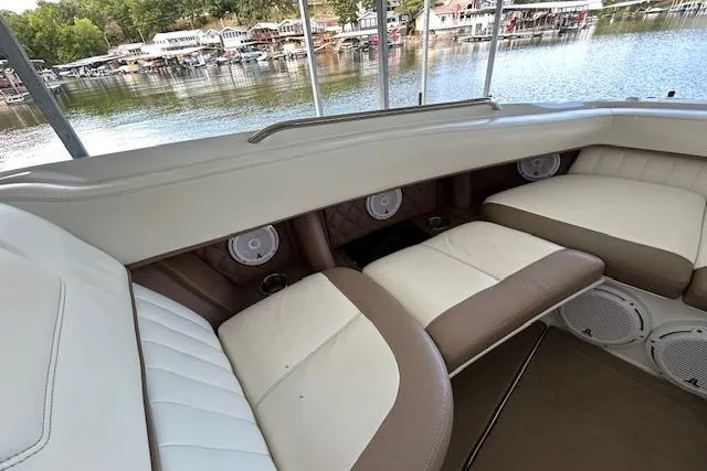 Slide: The Image of Luxurious seating on a 2011 Cobalt 302 boat with lake view in the background. - 14