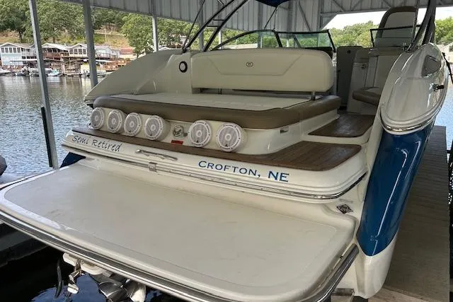 Slide: The Image of 2011 Cobalt 302 boat docked, featuring spacious seating and audio system, located in Crofton, NE. - 6