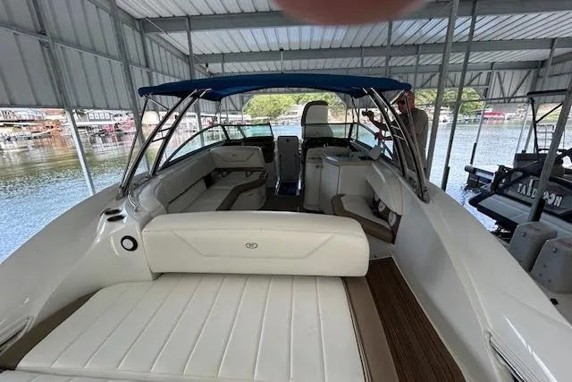 Slide: The Image of 2011 Cobalt 302 boat interior with seating under a covered dock. - 7