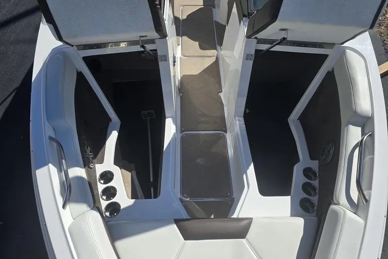 Slide: The Image of 2022 Cobalt R4 boat interior with seating and storage compartments. - 12