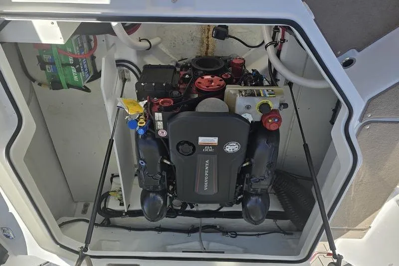 Slide: The Image of Engine compartment of a 2022 Cobalt R4 boat, featuring a Volvo Penta engine. - 17
